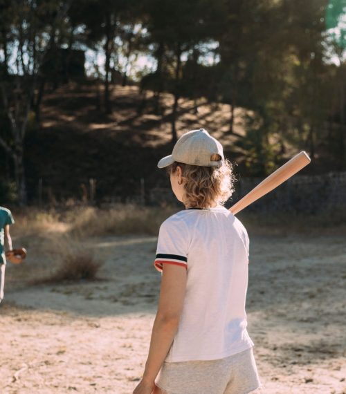 active-young-man-woman-playing-baseball-outdoors